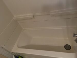 Before and after shower cleaning in Rockland, MA removing heavy buildup.