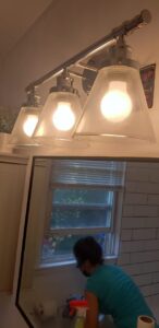 Light fixture before cleaning – dimmed by dust and buildup