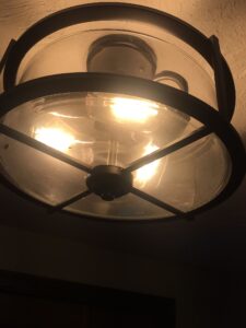 Light fixture before cleaning – dull from dust and dirt