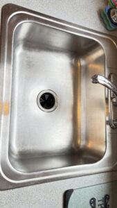 before and after stainless steel sink cleaning in a residential kitchen in Whitman MA