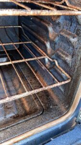 Oven rack before cleaning with grease and baked-on residue