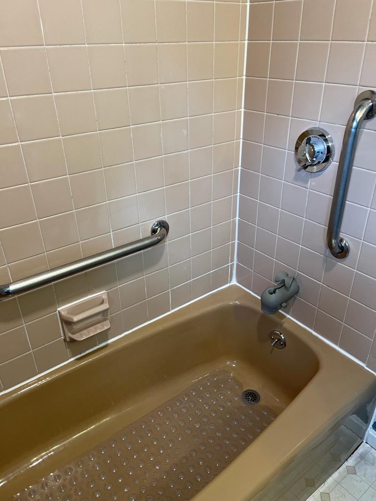 Bathtub and tiled shower walls after cleaning in Quincy, MA
