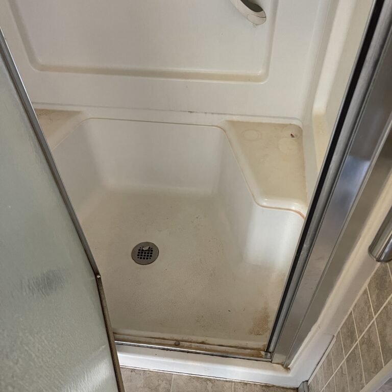 Shower glass with soap scum before cleaning in Whitman, MA