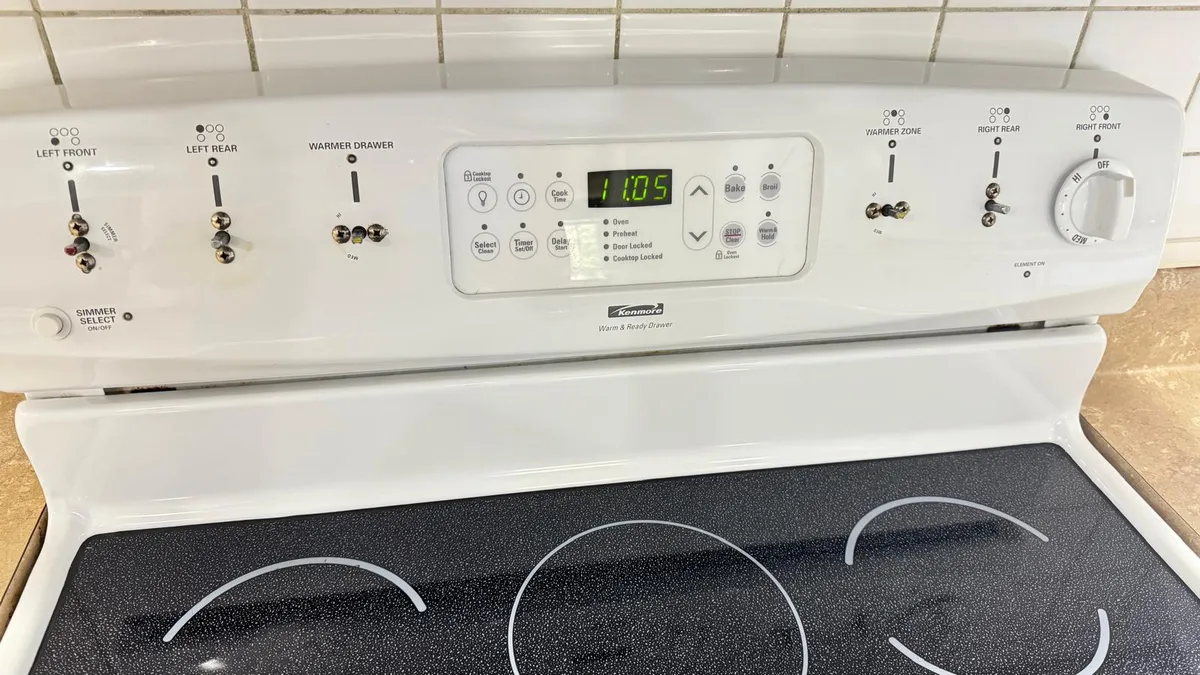 Stove control panel after professional cleaning, grease removed